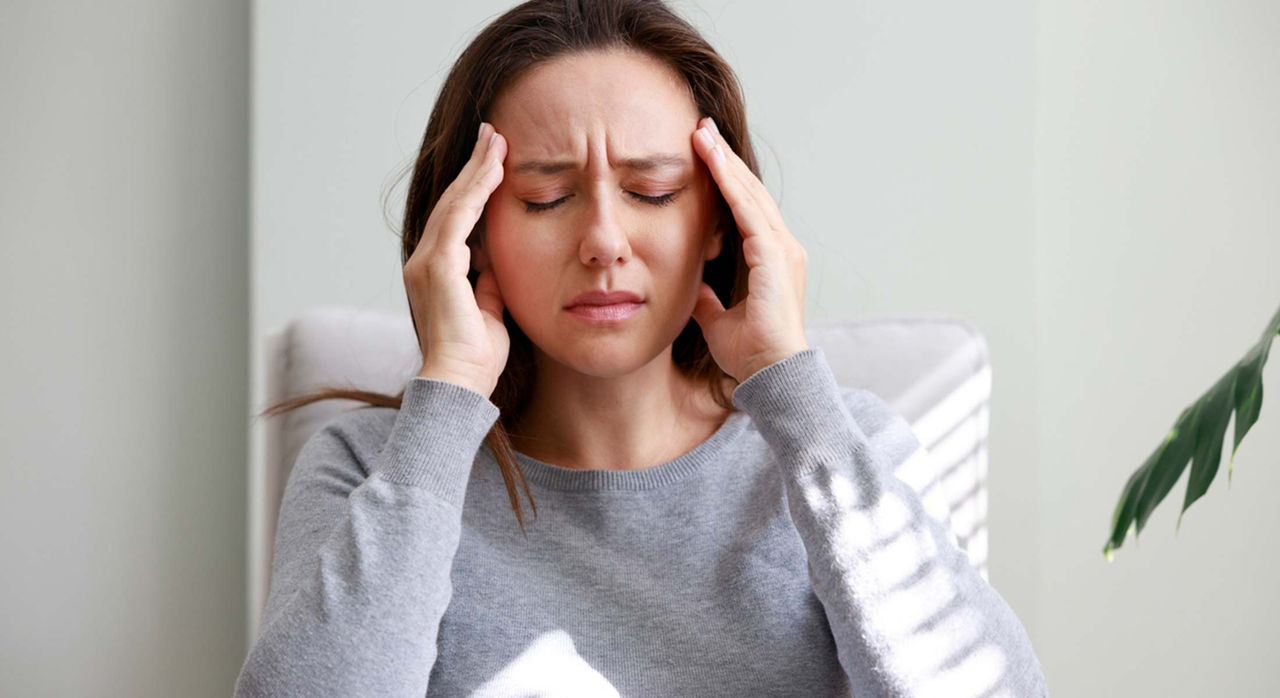 Woman with headache symptoms — early neuro diagnosis at JP Diagnostics